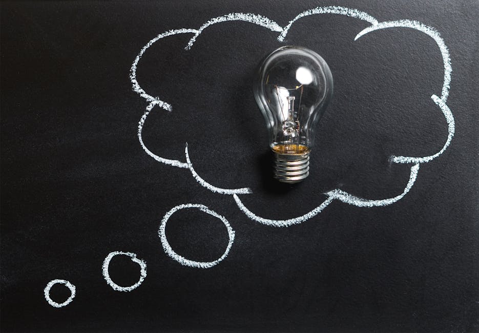 Light bulb on chalkboard symbolizing creative ideas